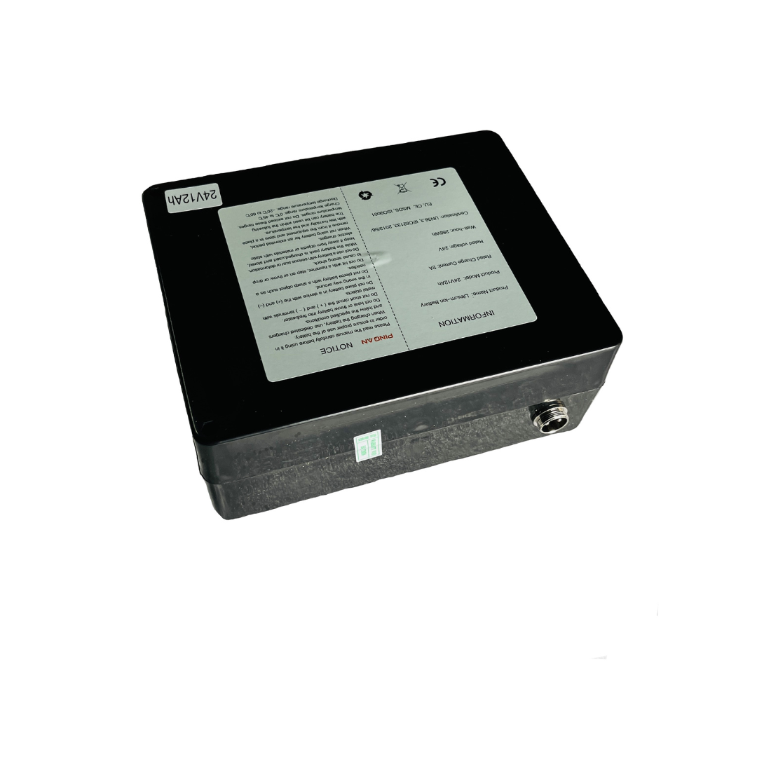 A rectangular black Battery for The Miracle Mobility 6000 & 8000 Powerchairs, featuring a top label with text, warnings, and symbols plus a metal side connector, shown on a white background.